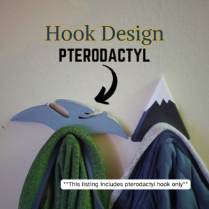 A pterodactyl coat hook designed to hang sweatshirts, jackets and towels created by Ziggy Zig Designs.
