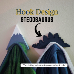 A Stegosaurus coat hook designed to hang sweatshirts, jackets and towels created by Ziggy Zig Designs.